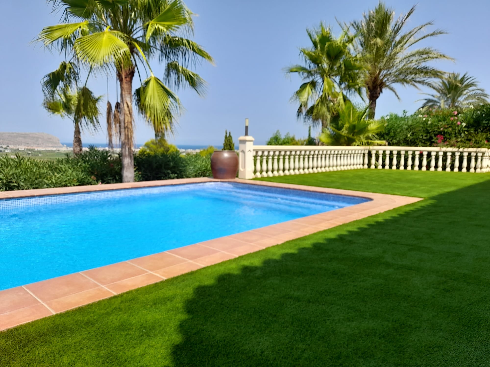 Artificial grass pool surround luxury villa Spain
