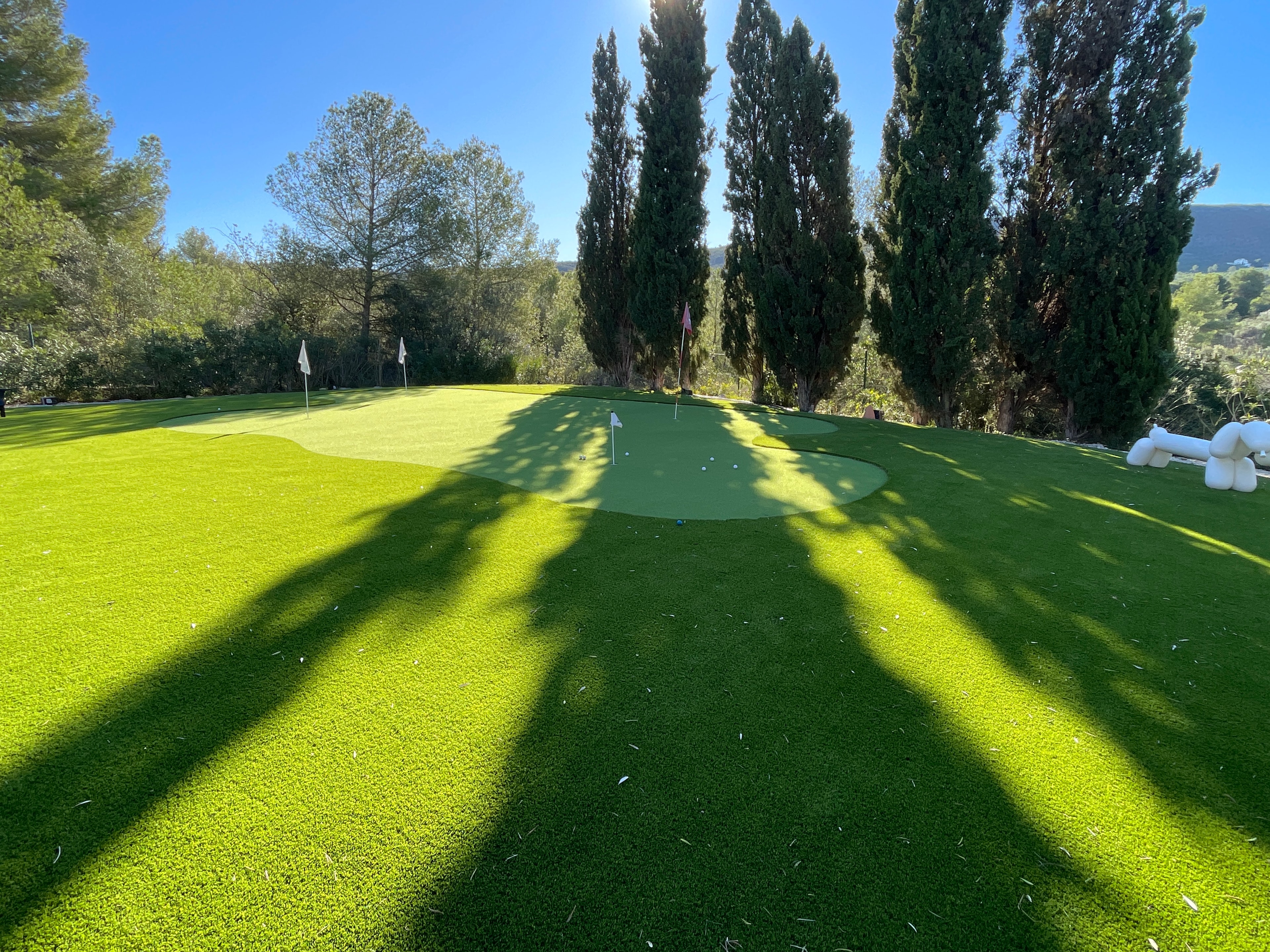 Golf putting green with flags artificial grass Spain