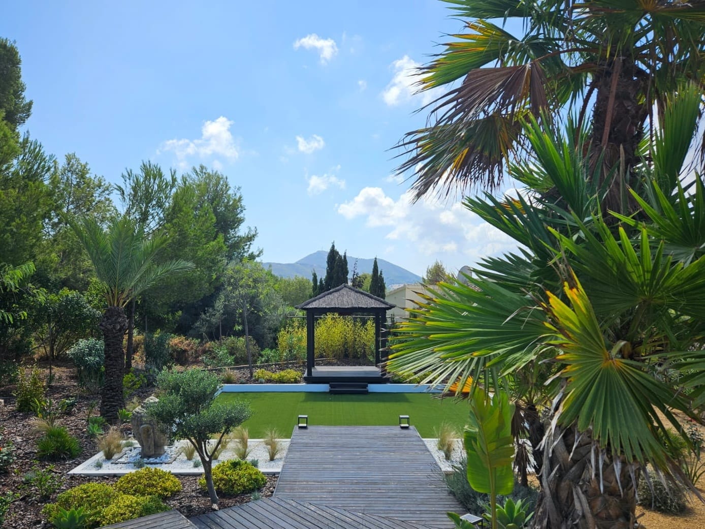 Modern villa garden with stepping stones pool and artificial grass Costa Blanca