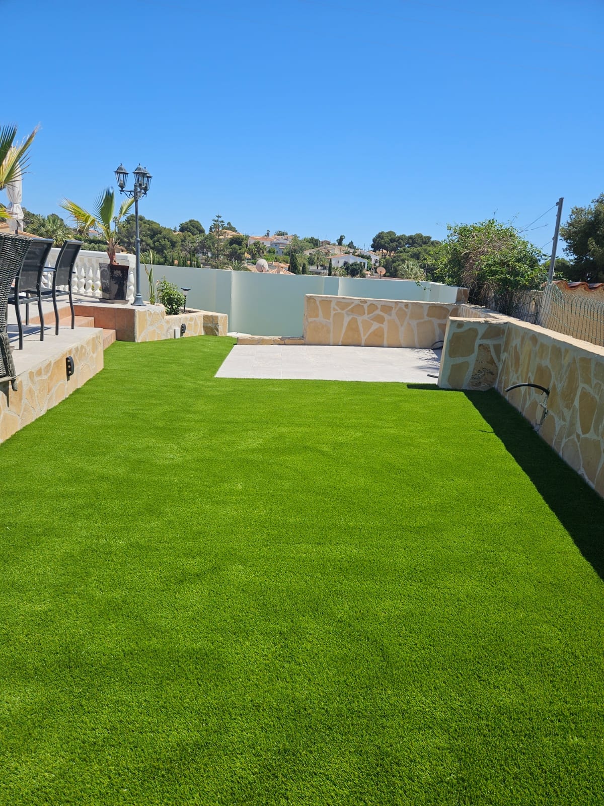 Walled garden with artificial grass and stone terrace Costa Blanca