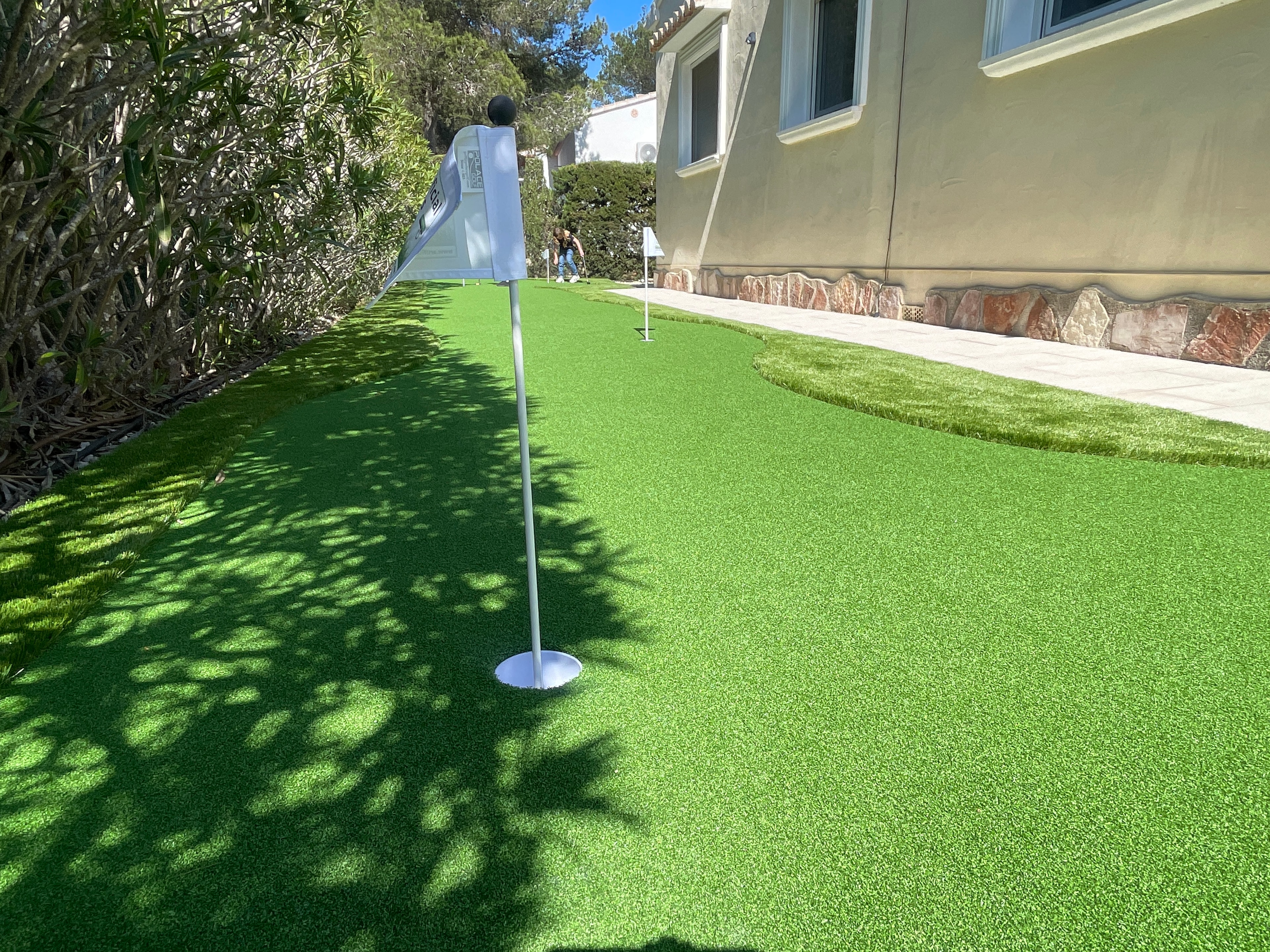 Home golf practice area with artificial grass putting green Spain