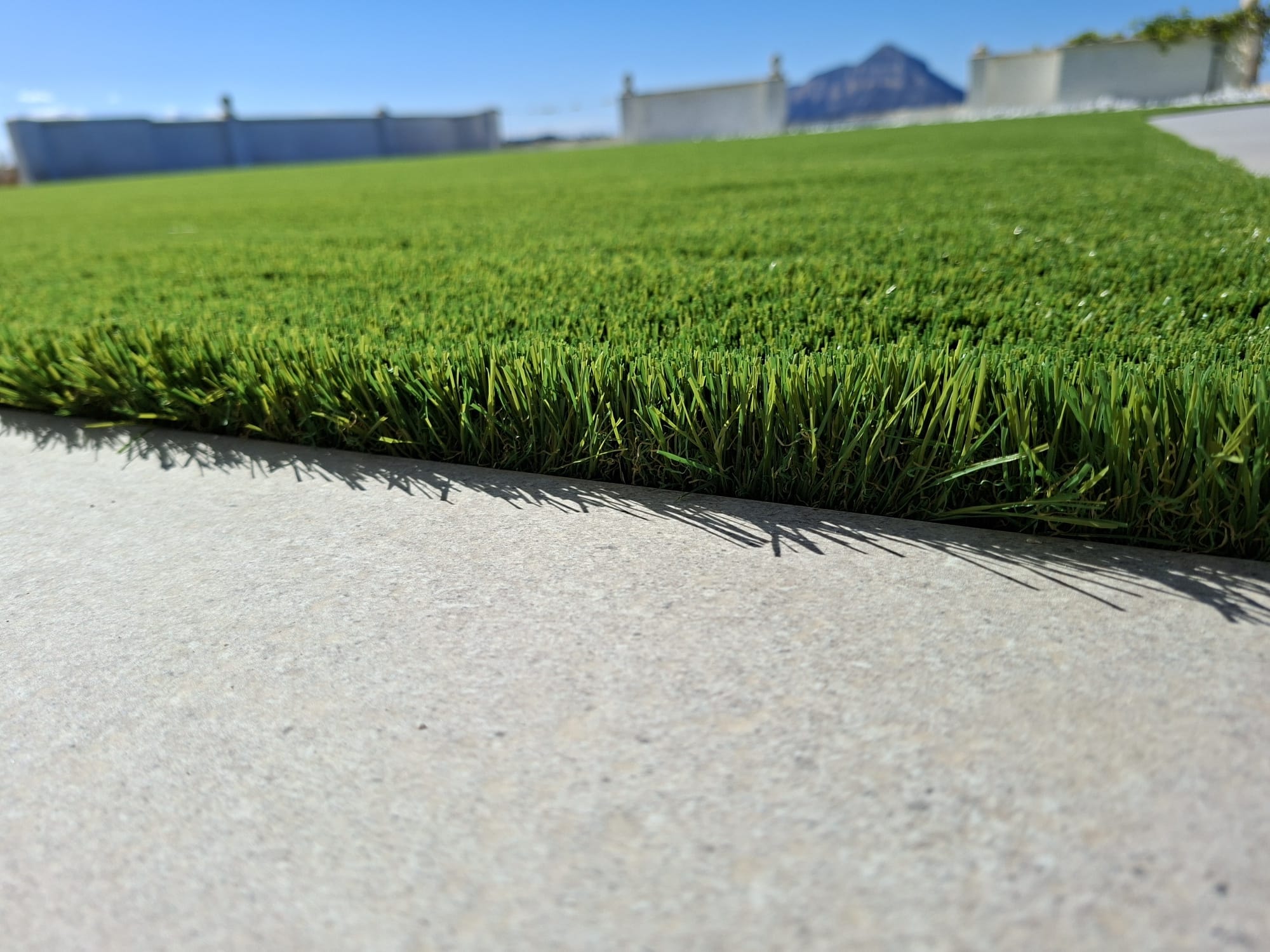 Artificial grass edge detail with porcelain tile Costa Blanca